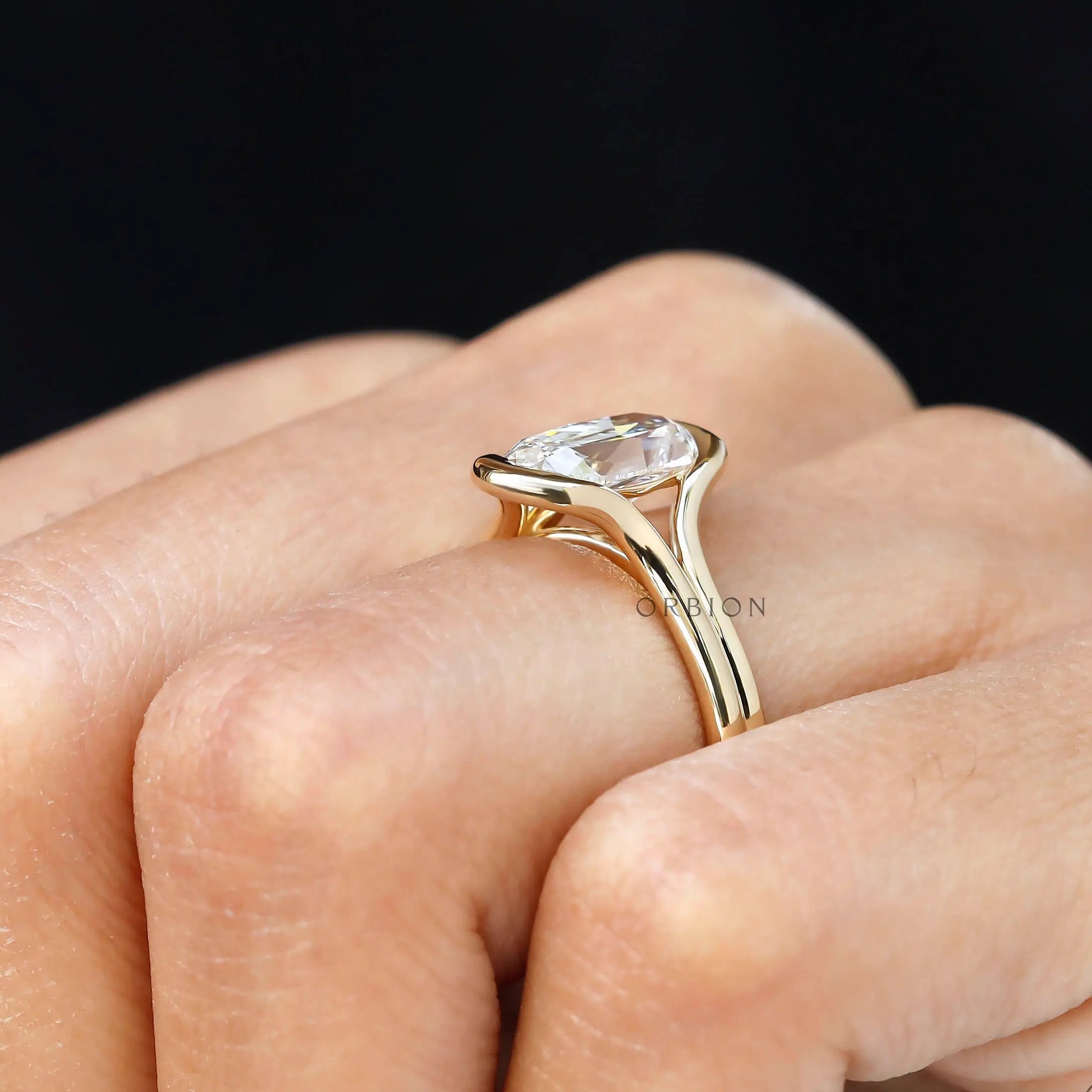 Hand view floating elongated cushion lab diamond ring