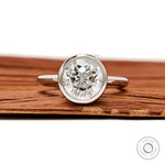 Front view round star cut diamond ring in floating bezel setting