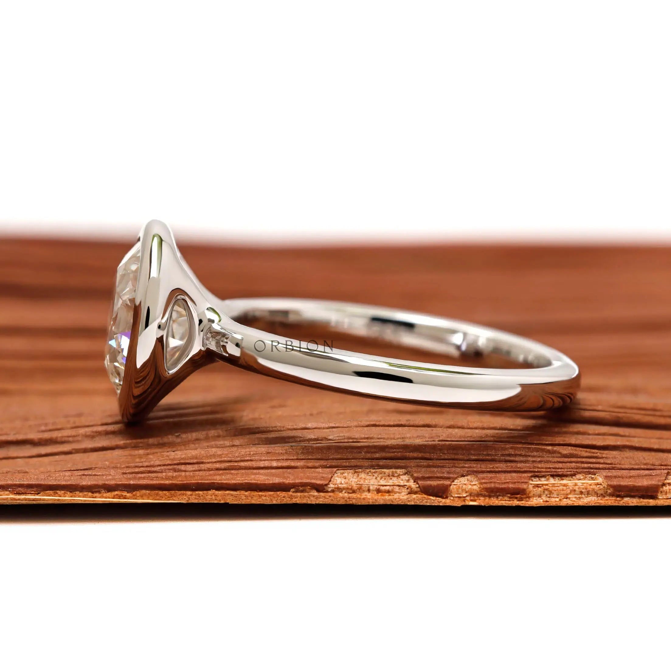 Side profile floating bezel round diamond solitaire ring in white gold