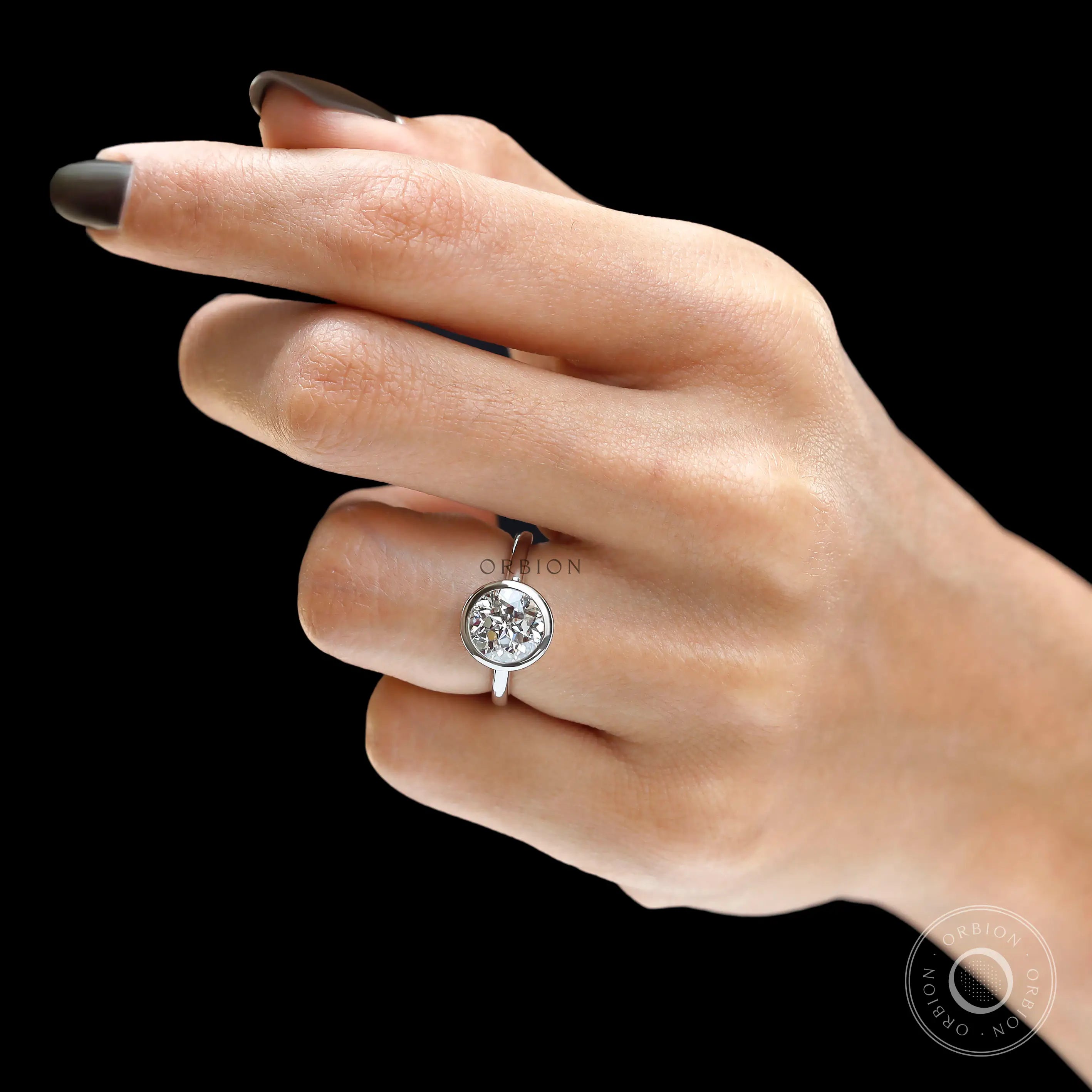 Full hand view floating bezel round diamond engagement ring