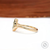 Side profile of dainty marquise lab diamond half bezel engagement ring.