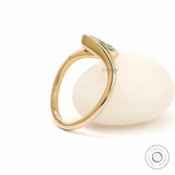 Back angle view of sculptural marquise lab diamond ring in yellow gold.
