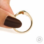 Curved bypass band marquise lab diamond ring in polished yellow gold.