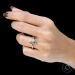 Dainty marquise lab diamond bypass ring worn elegantly on finger.