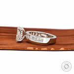 Profile angle showing elevated cushion diamond and gallery design.