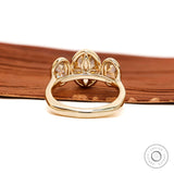 Back view revealing open gallery beneath three bezel set stones.