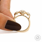 Held side view showing elevated oval bezels and tapered shank.