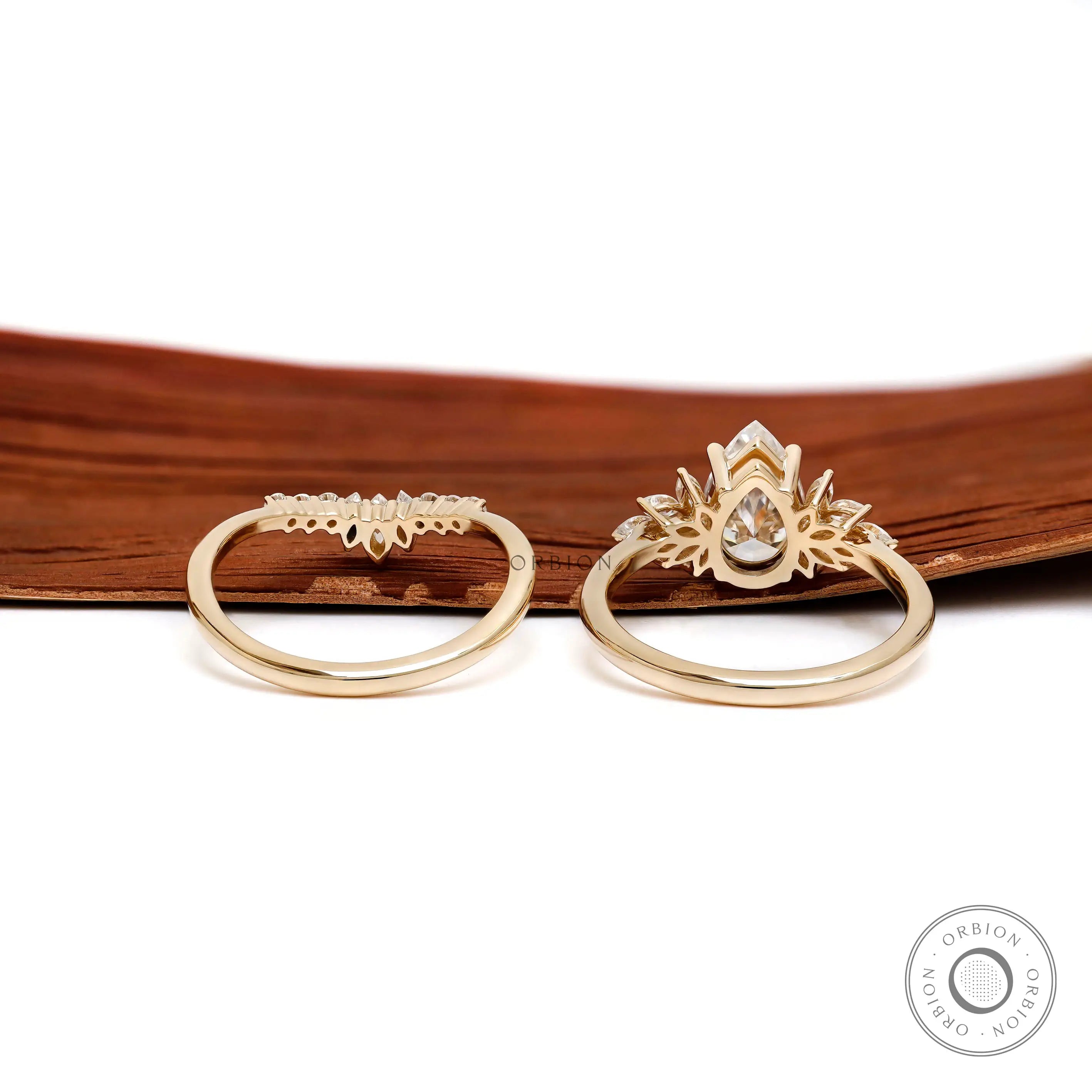 Back view of pear moissanite ring set in yellow gold