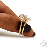 Side finger view of pear moissanite ring set