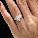 Hand view of pear moissanite cluster engagement ring set