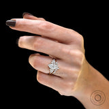 Close hand view of pear moissanite floral ring set