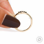 Front held view highlighting five stone bar set baguette design.