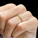Worn side view showing slim profile of five stone baguette ring.