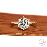 Front view round solitaire lab diamond ring in yellow gold.