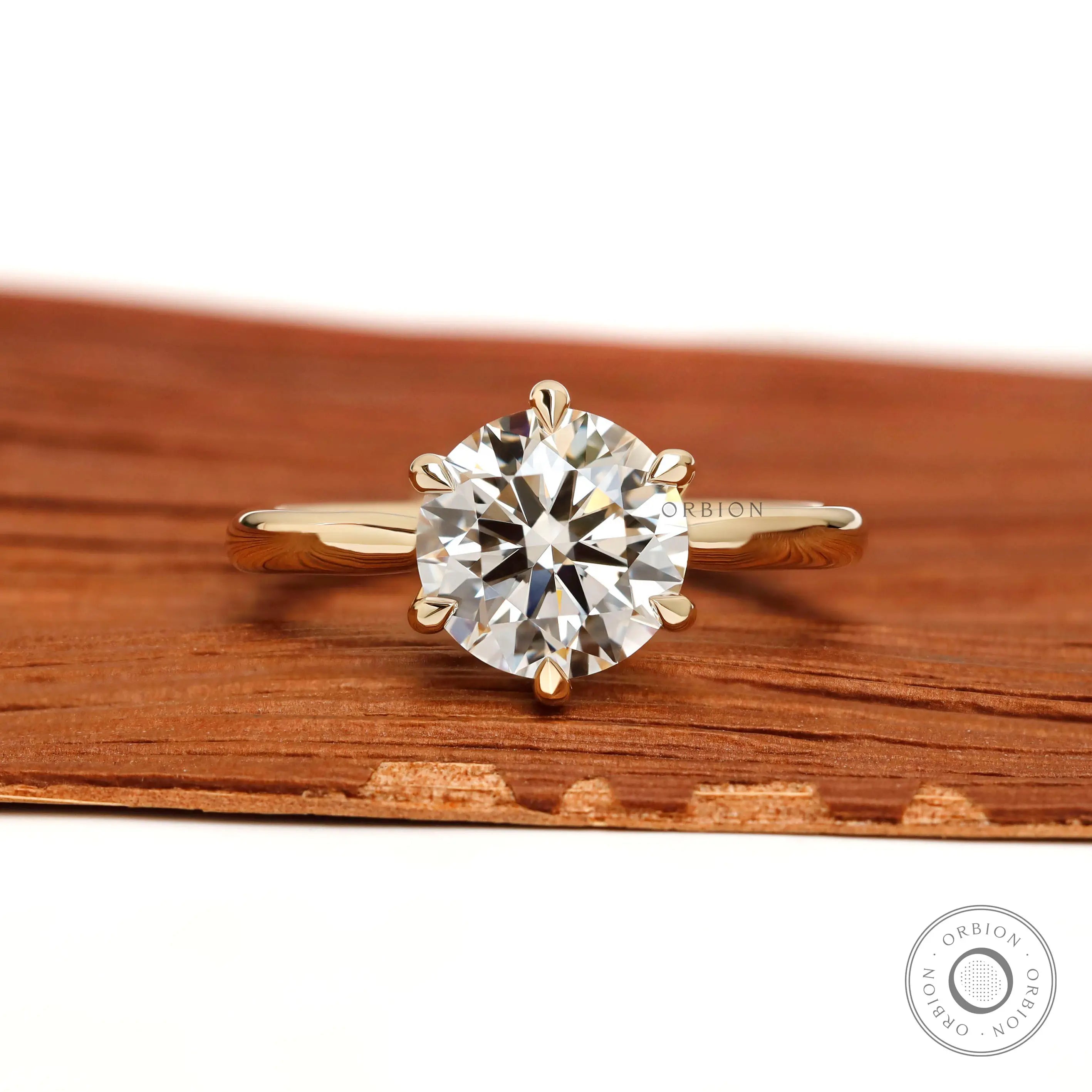 Front view round solitaire lab diamond ring in yellow gold.