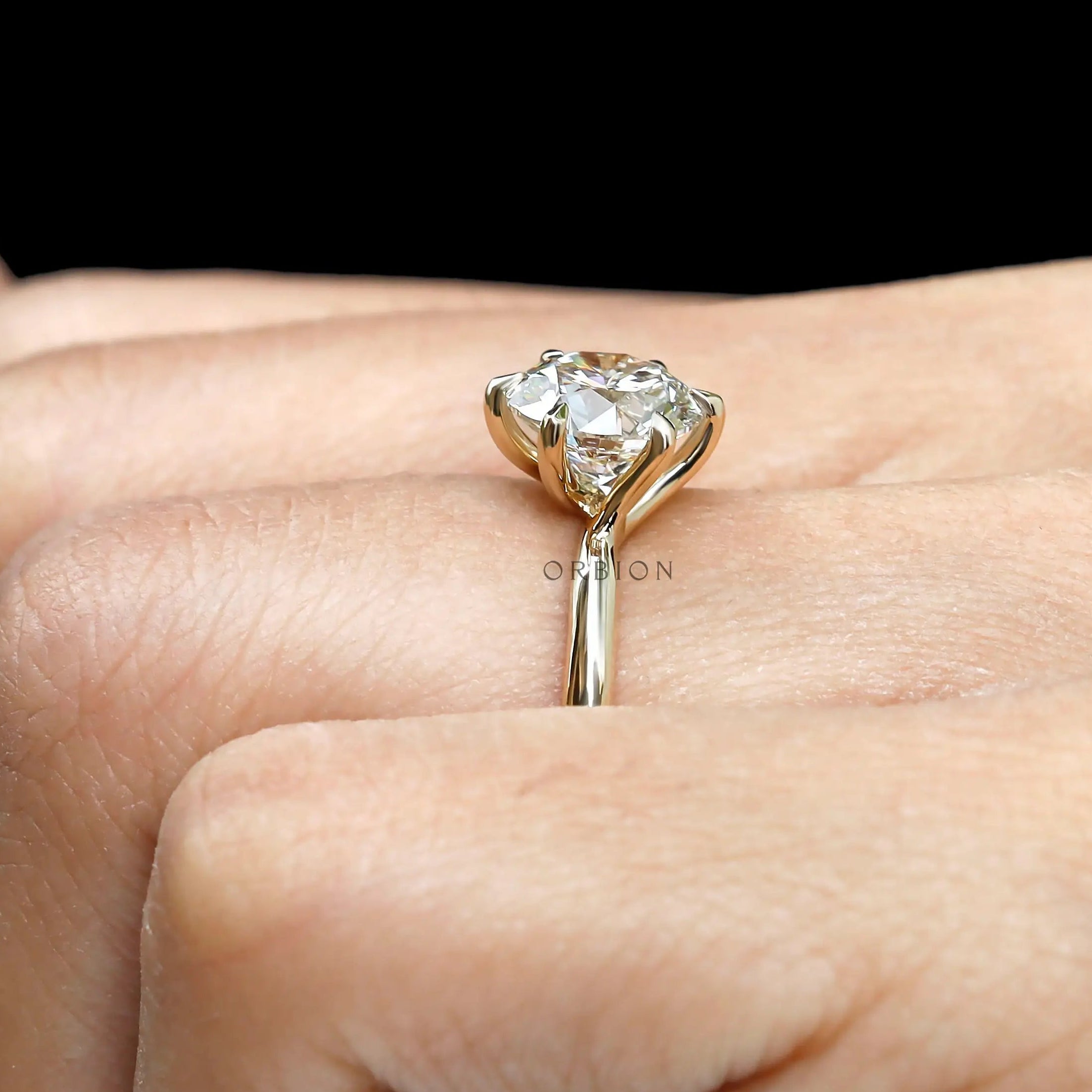 Side close view showing twisted gallery and elevated solitaire.