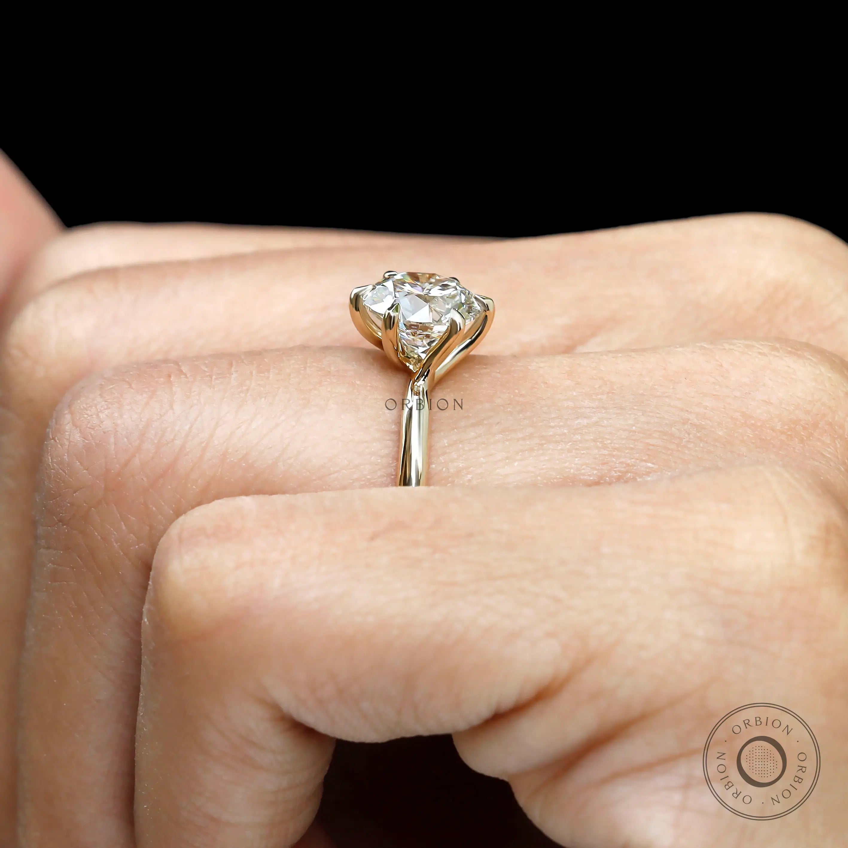 Side close view showing twisted gallery and elevated solitaire.