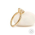 Back angled view highlighting twisted gallery beneath round diamond.