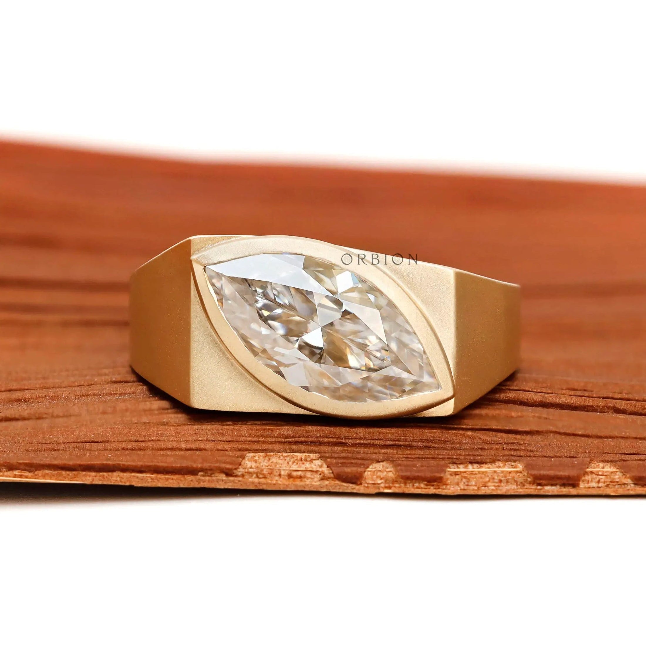 Marquise moissanite signet ring in 10k yellow gold