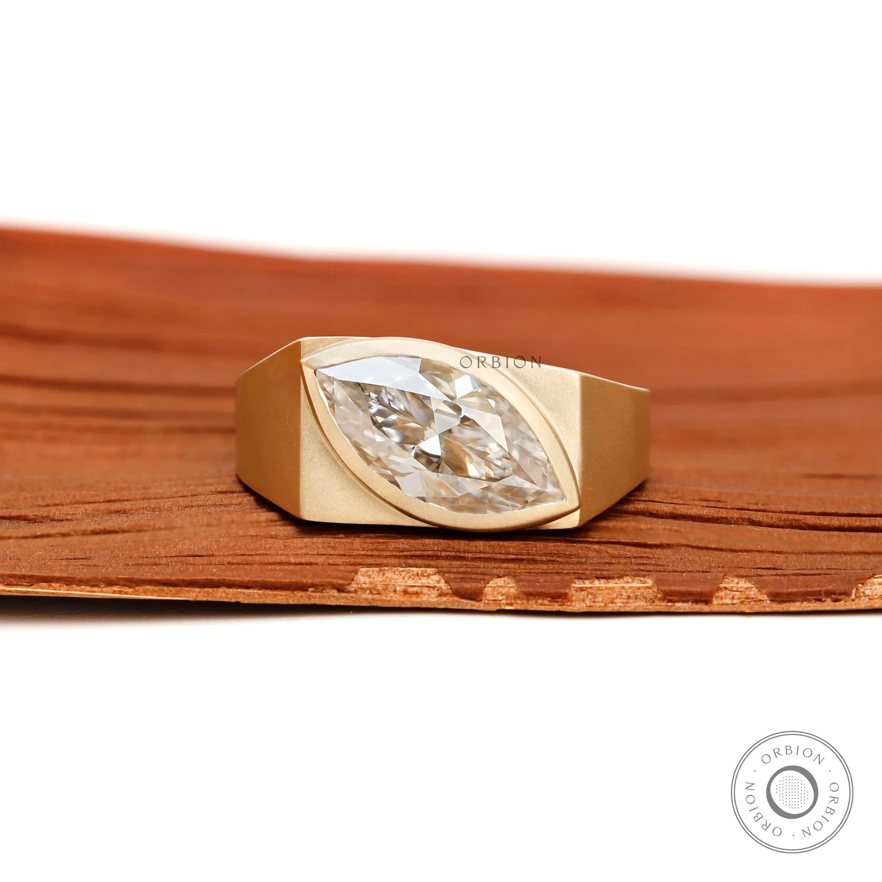 Marquise moissanite signet ring in 10k yellow gold