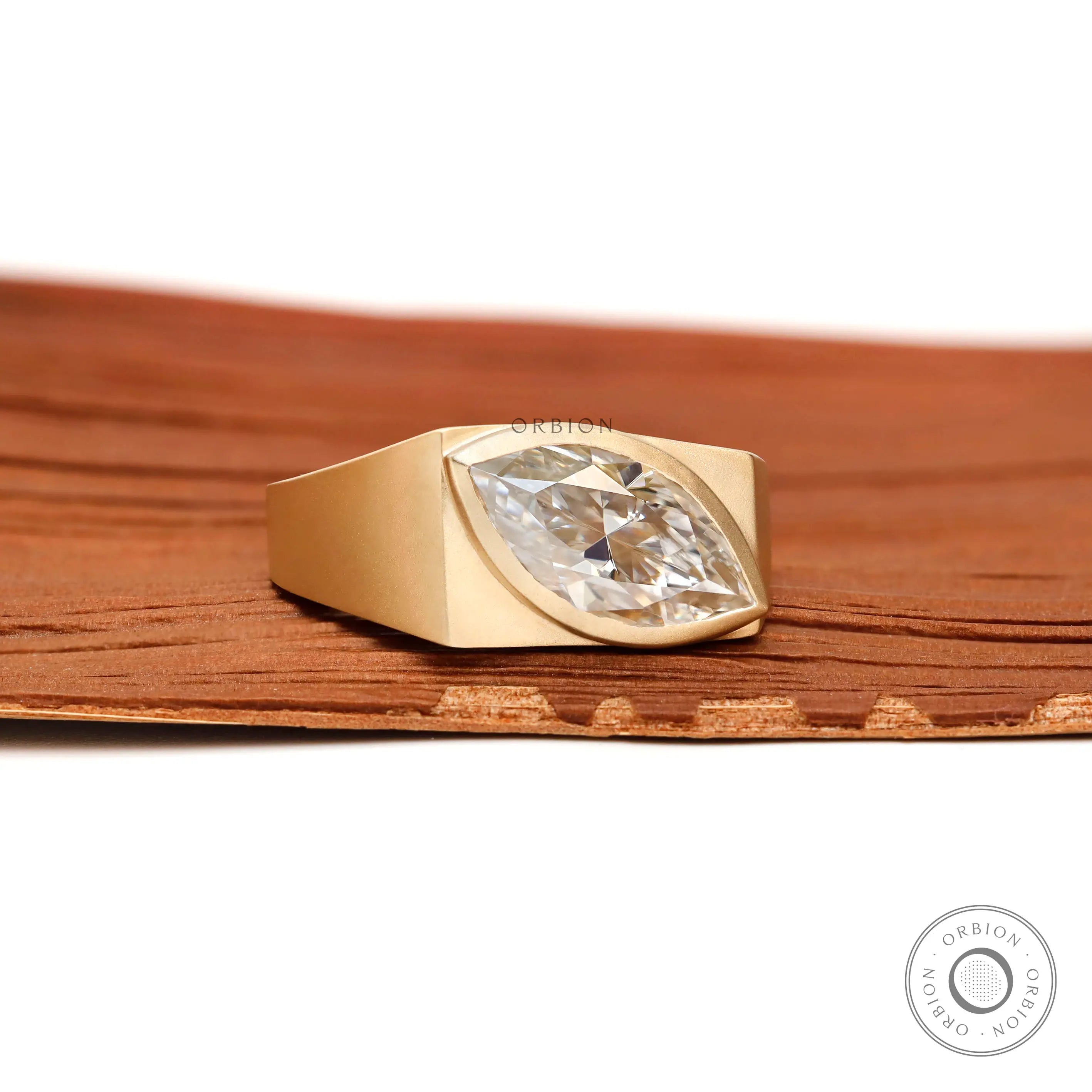 Modern yellow gold marquise signet ring design