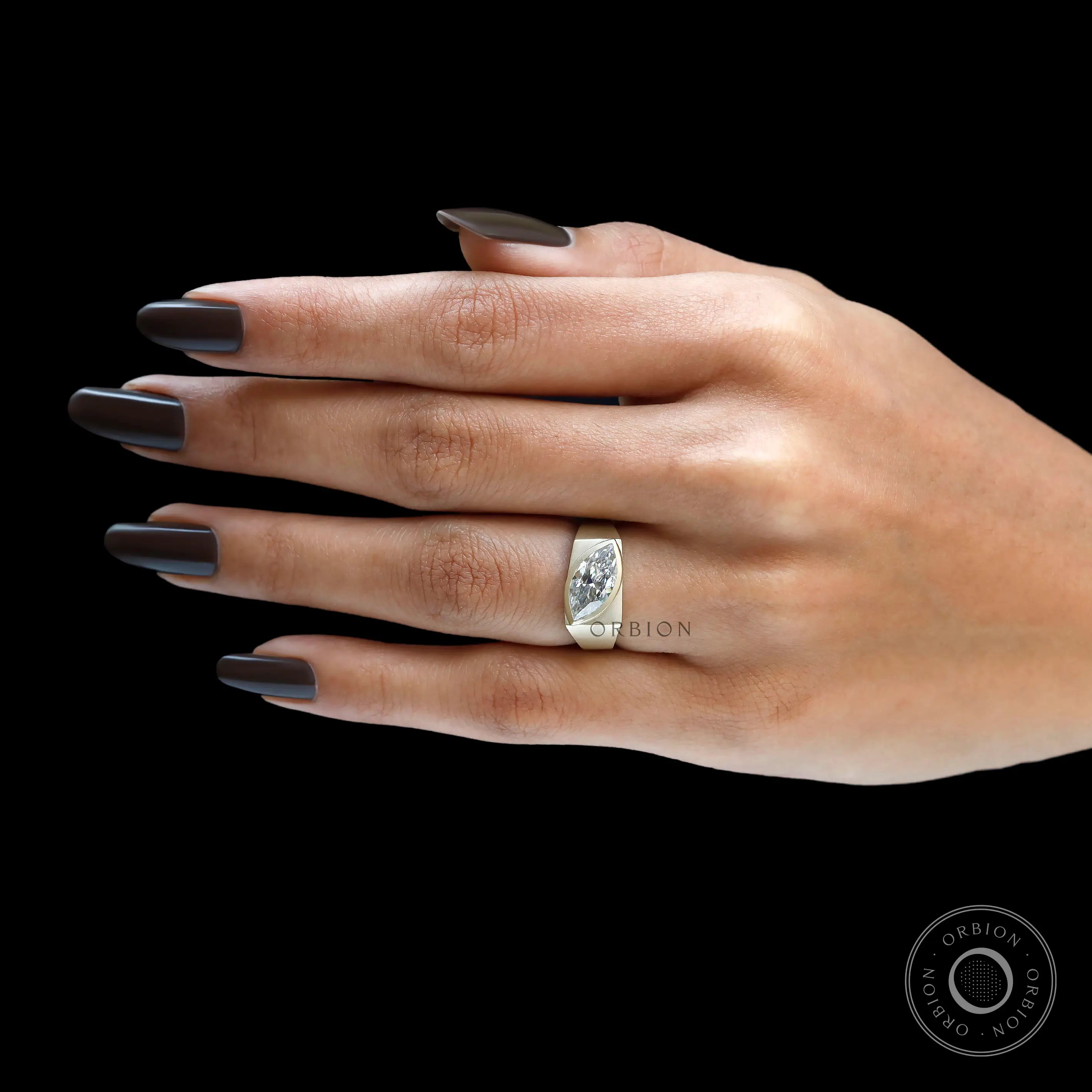 Marquise moissanite signet ring worn on hand