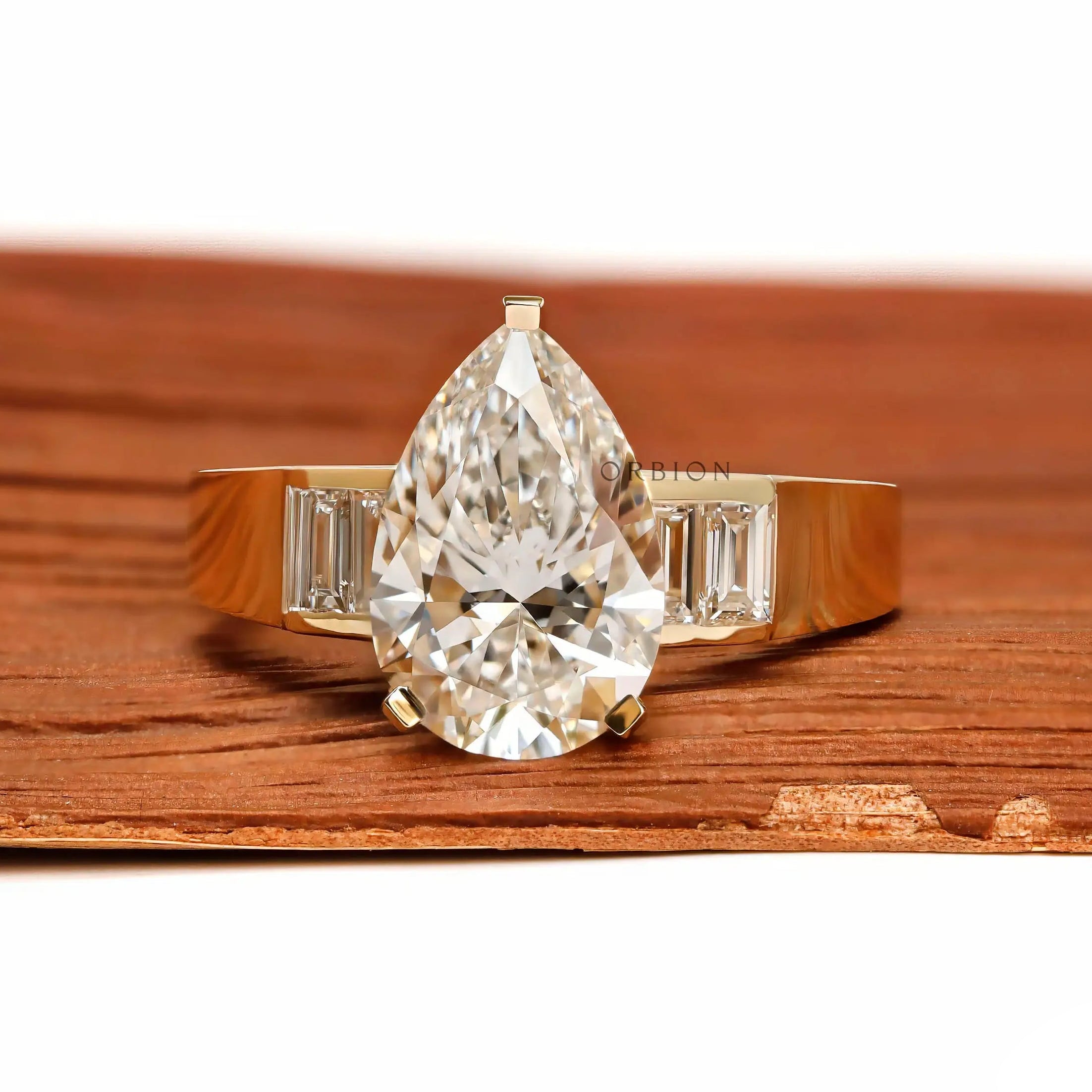 Front view pear lab diamond ring with baguette side stones