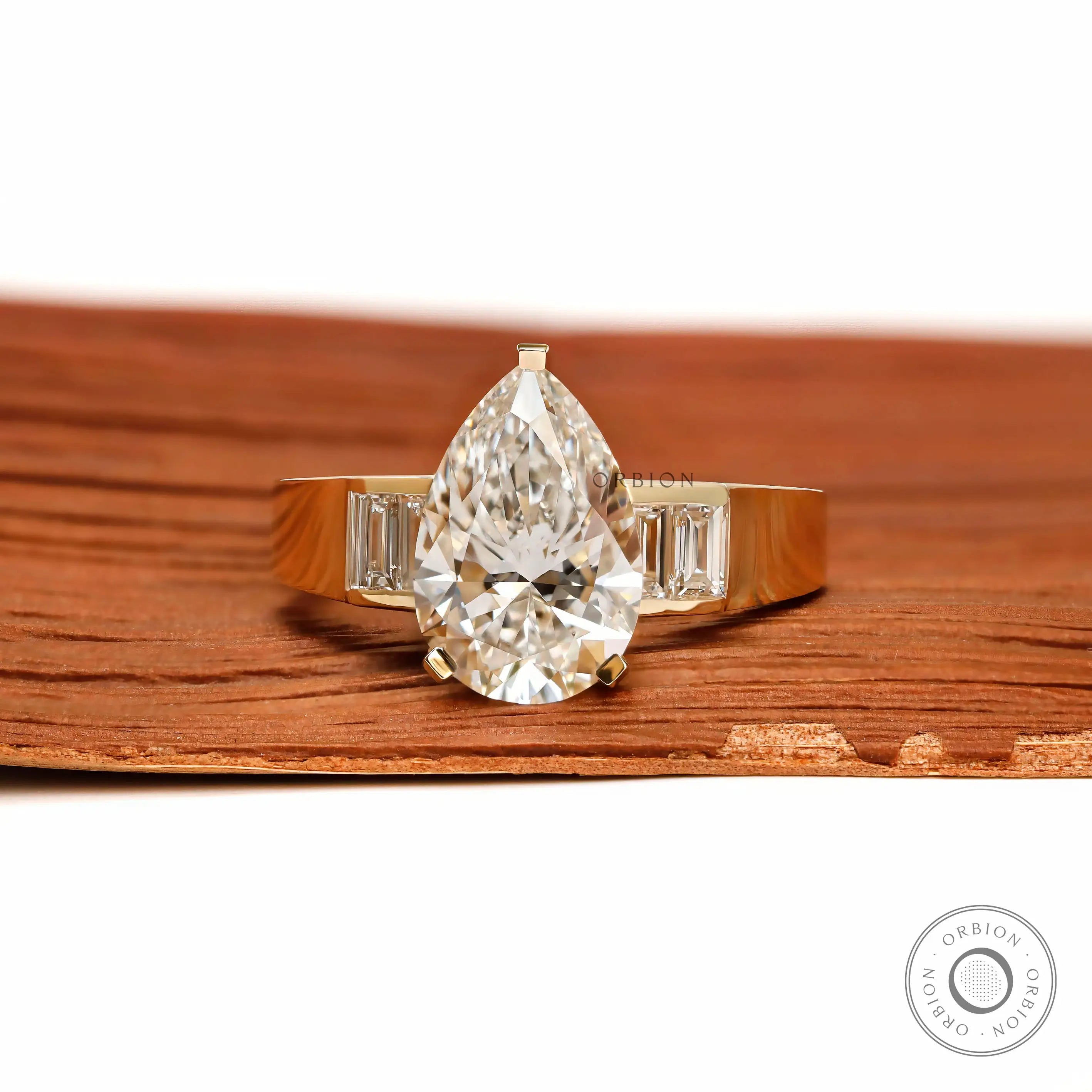 Front view pear lab diamond ring with baguette side stones