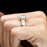 Top hand view pear lab diamond ring with baguette sides