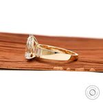 Side profile pear lab diamond ring with tapered yellow gold band