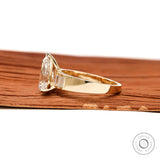 Side profile pear lab diamond ring with tapered yellow gold band