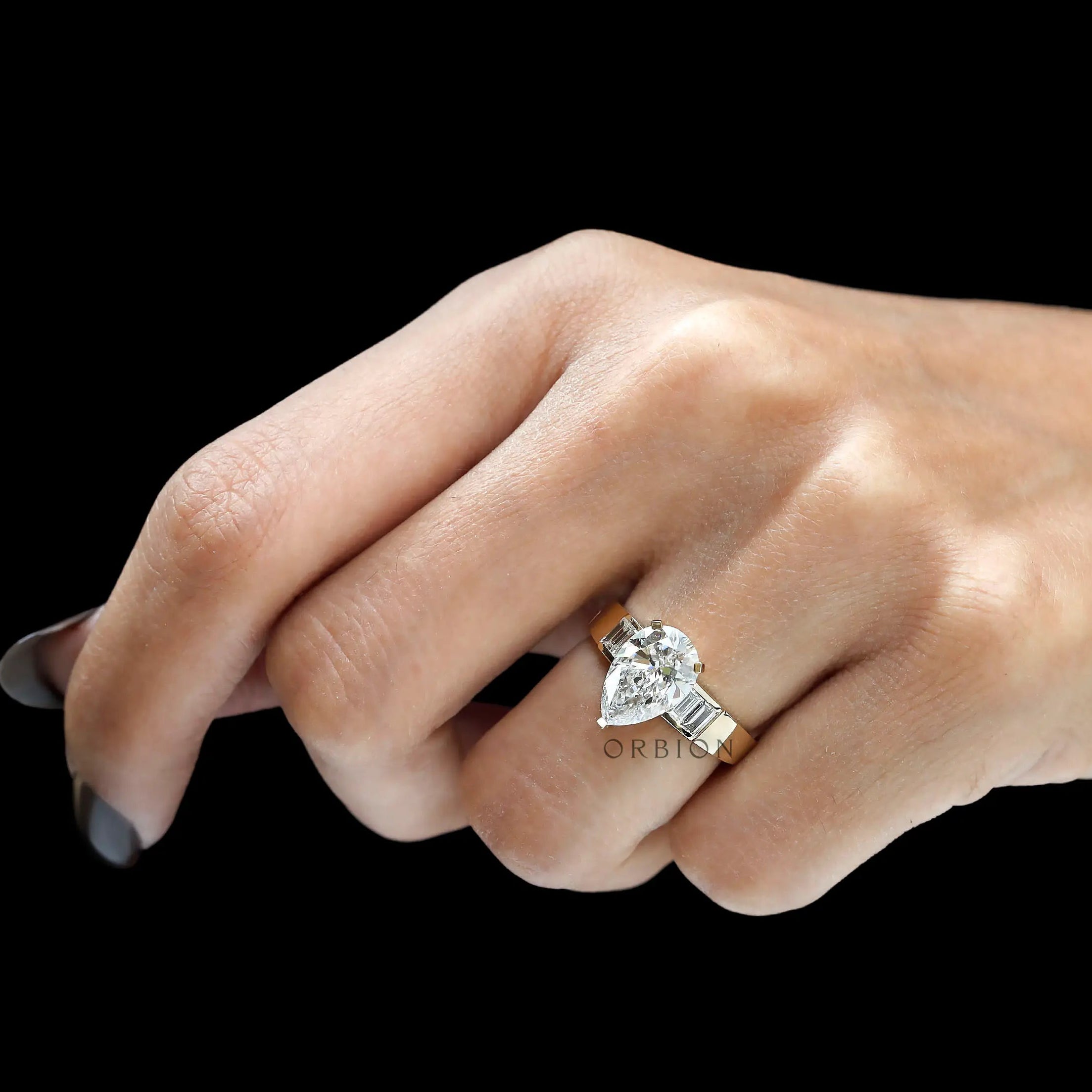 Hand view pear lab diamond ring in yellow gold