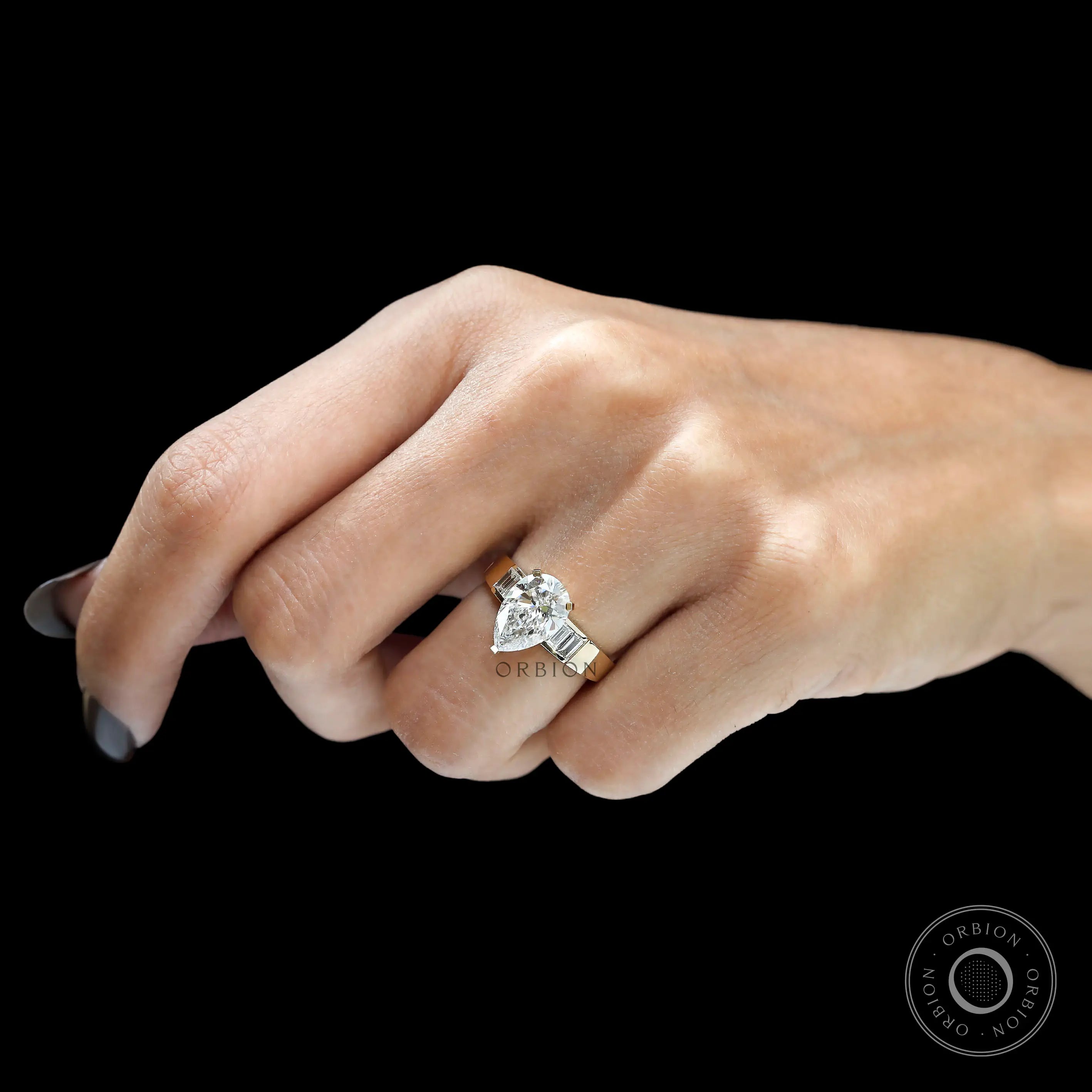 Hand view pear lab diamond ring in yellow gold