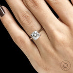 Elegant cushion cut moissanite wedding ring with platinum setting, cathedral profile and hidden halo 