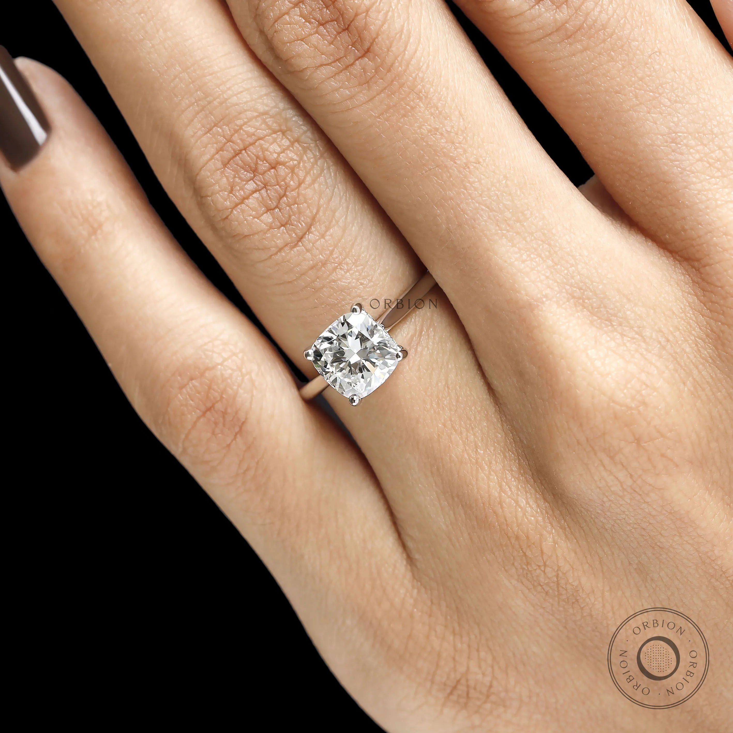 Elegant cushion cut moissanite wedding ring with platinum setting, cathedral profile and hidden halo 