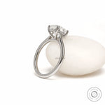 Cushion cut lab grown diamond engagement ring with hidden halo and platinum cathedral setting for women