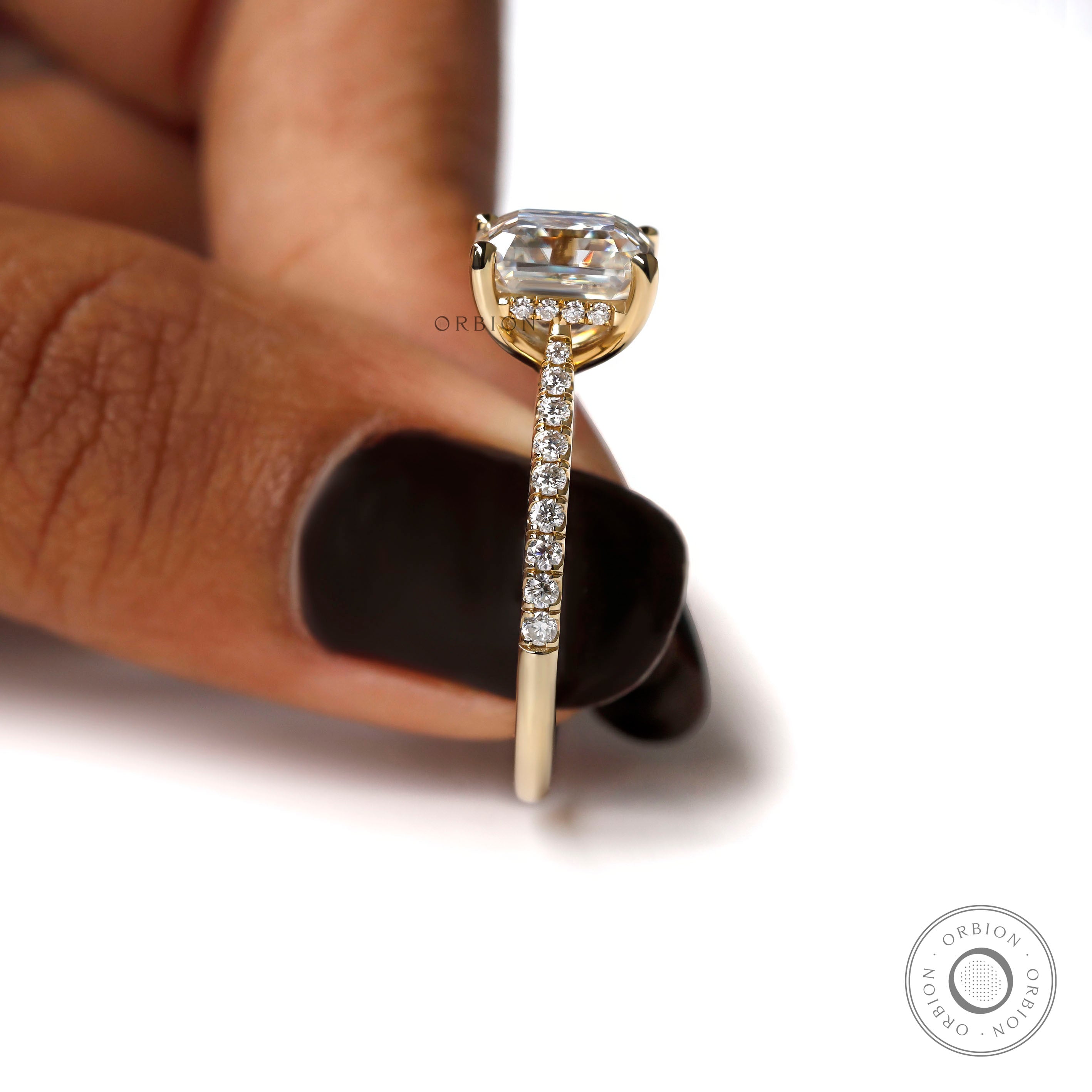 Minimal cathedral engagement ring with Asscher center stone