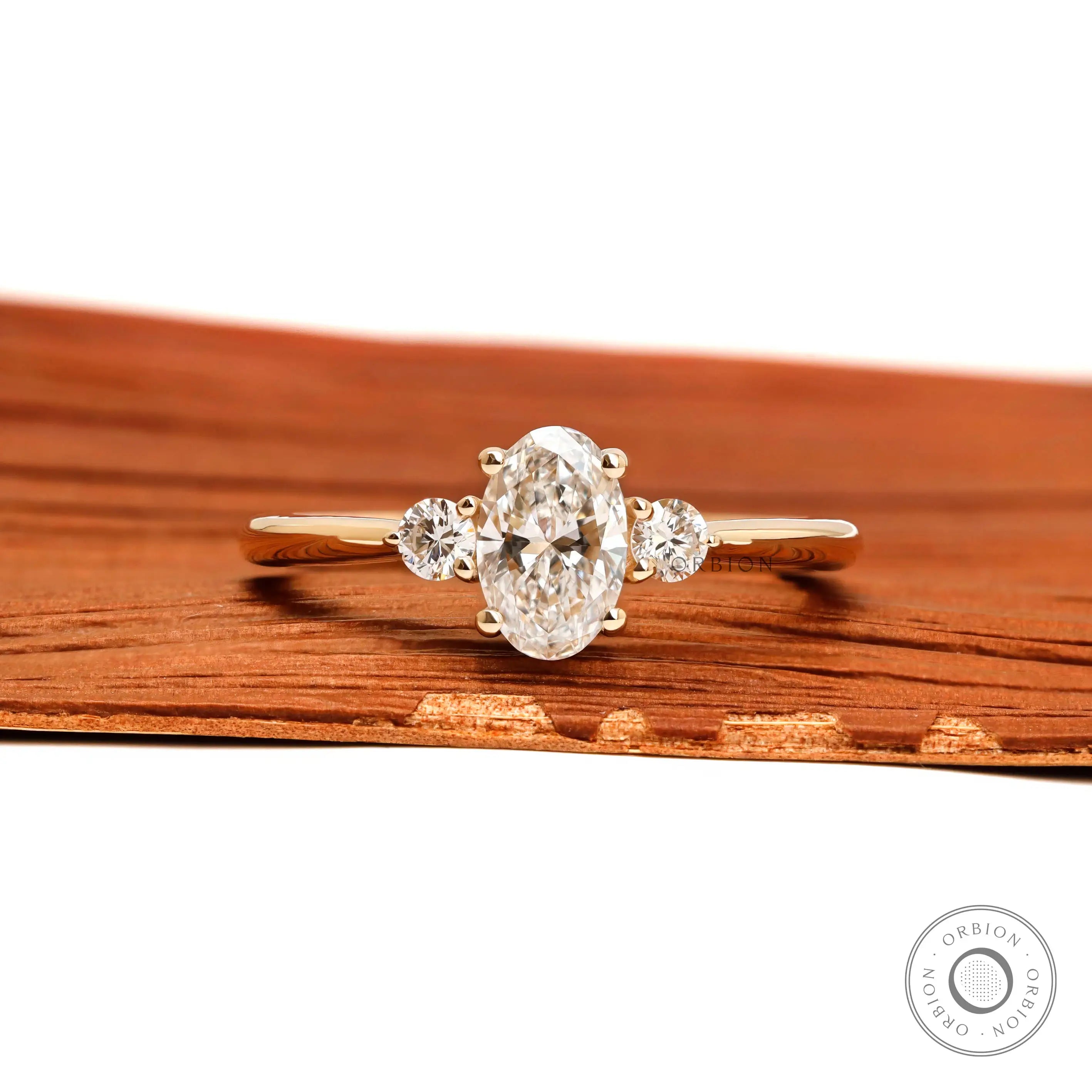 Dainty oval three stone lab diamond ring in 10k yellow gold front view
