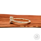 Yellow gold oval engagement ring showing slim polished band