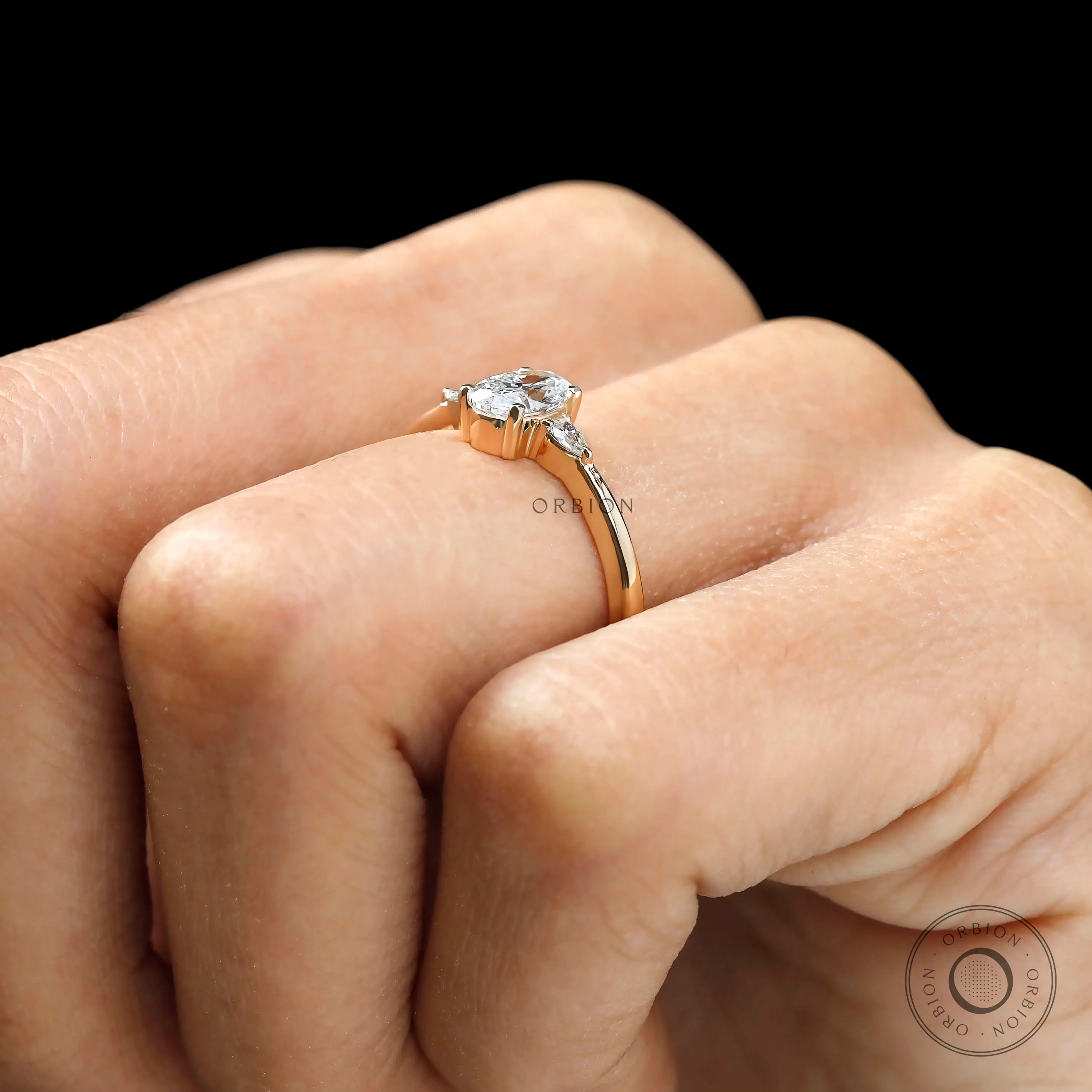  Trilogy oval lab diamond ring yellow gold side view on finger 