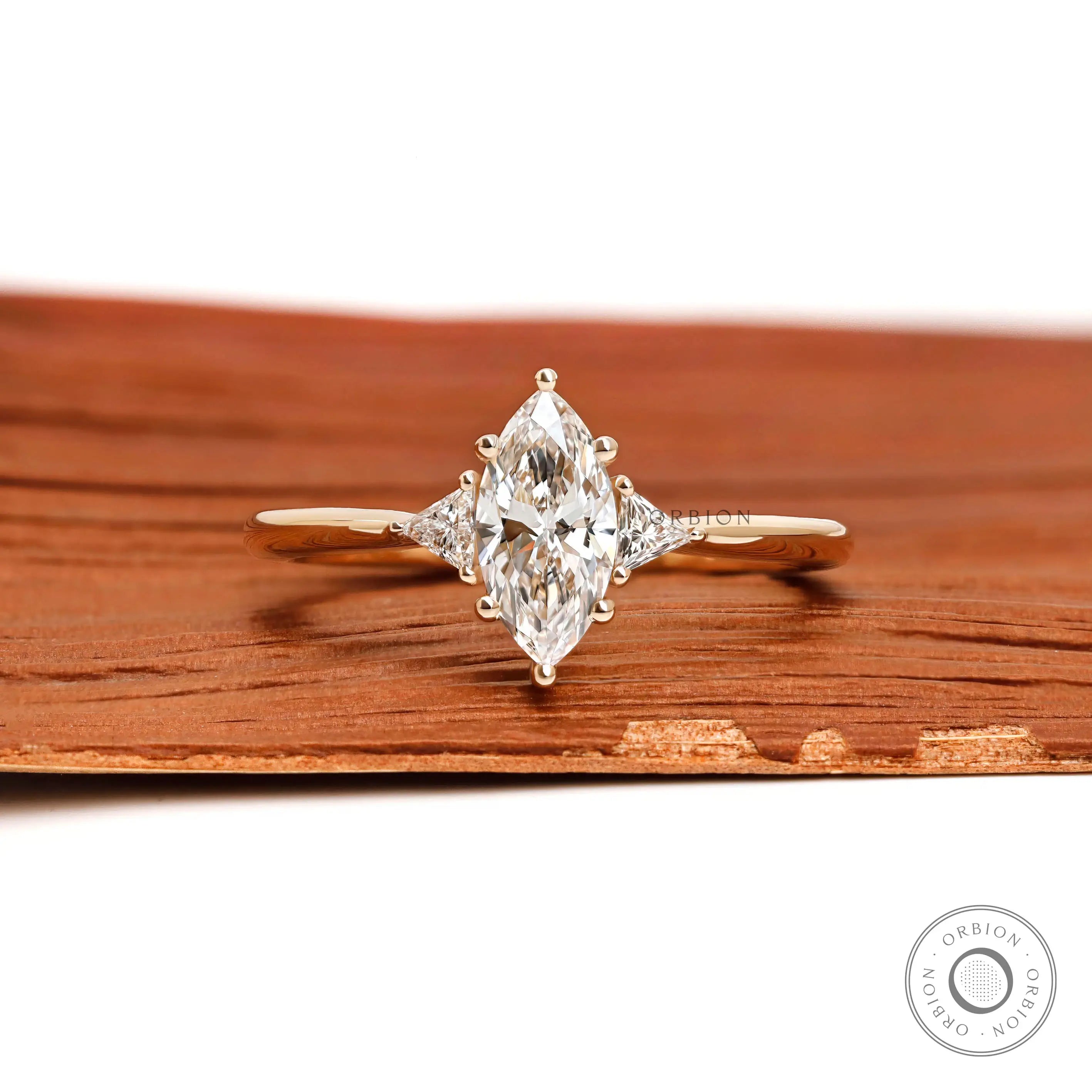 Marquise three stone lab diamond ring in 10k yellow gold front view