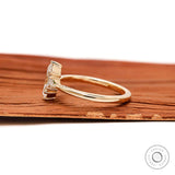 Side profile of marquise three stone yellow gold ring