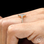 Marquise and pear three stone moissanite ring yellow gold on finger