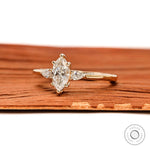 Side profile of marquise engagement ring showing prong setting