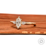 Side profile of marquise engagement ring showing prong setting