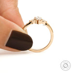 pear side stones on marquise trilogy engagement ring yellow gold