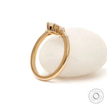 Marquise cut center stone with pear side stones yellow gold ring
