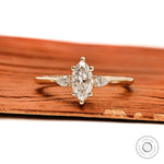 Marquise and pear three stone lab diamond ring in 10k yellow gold front view