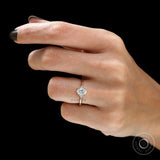 Fine jewelry oval engagement ring on finger