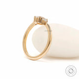 Prong set oval diamond three stone ring yellow gold